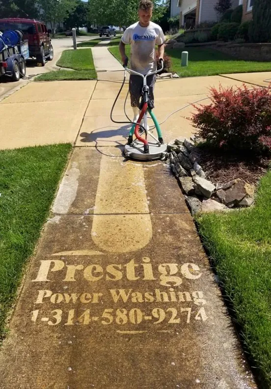 An image of prestige power washing with water mark